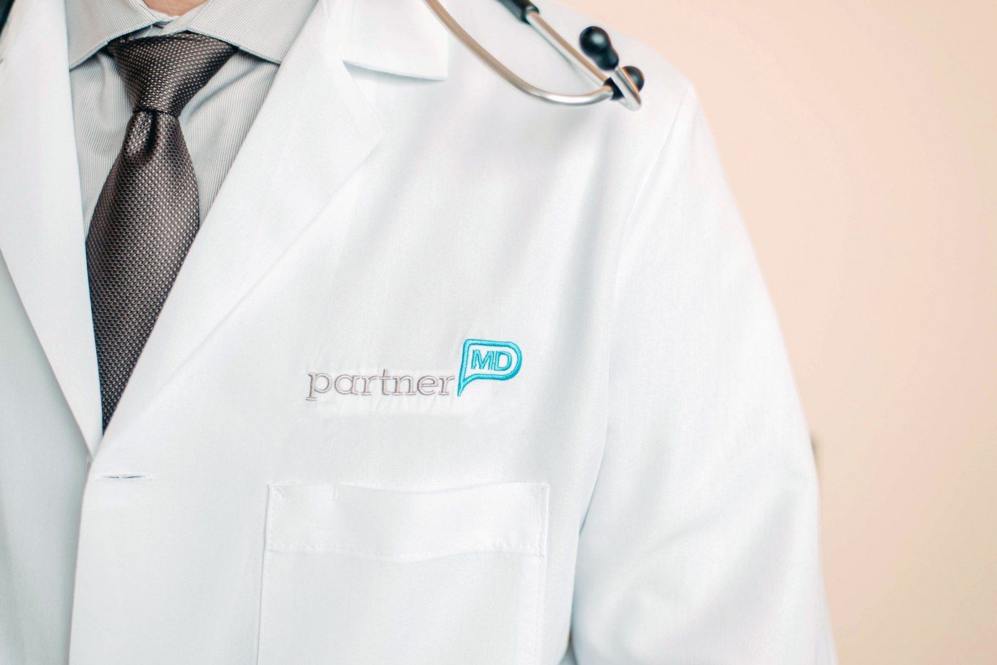 PartnerMD physician in a white coat
