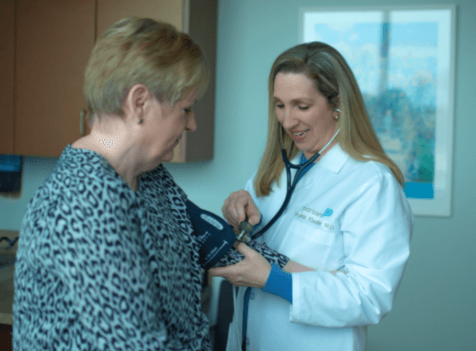 Dr. Kladder, a concierge physician, with a patient