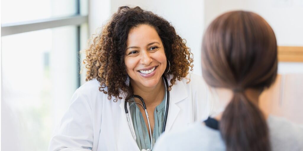 Primary care doctor with patient