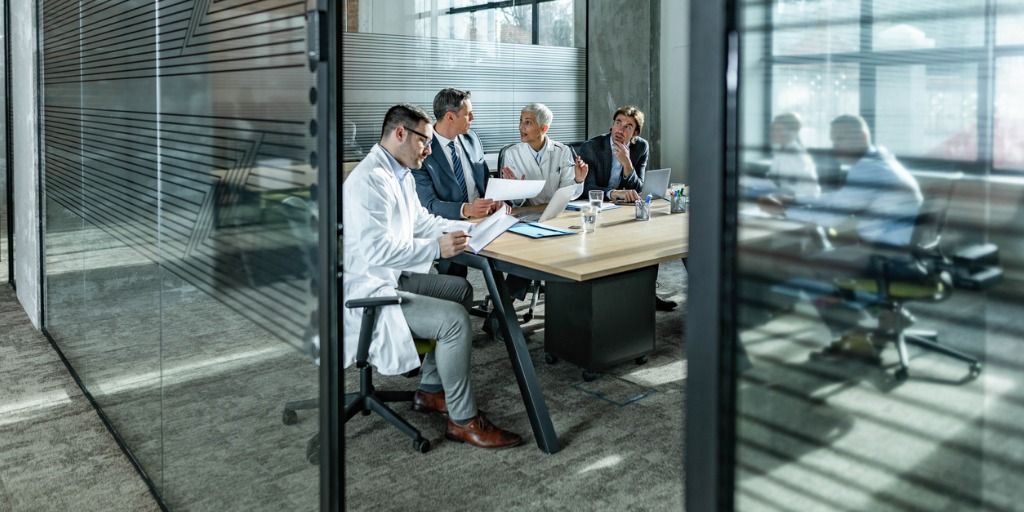 Group of concierge doctors in a meeting room. 