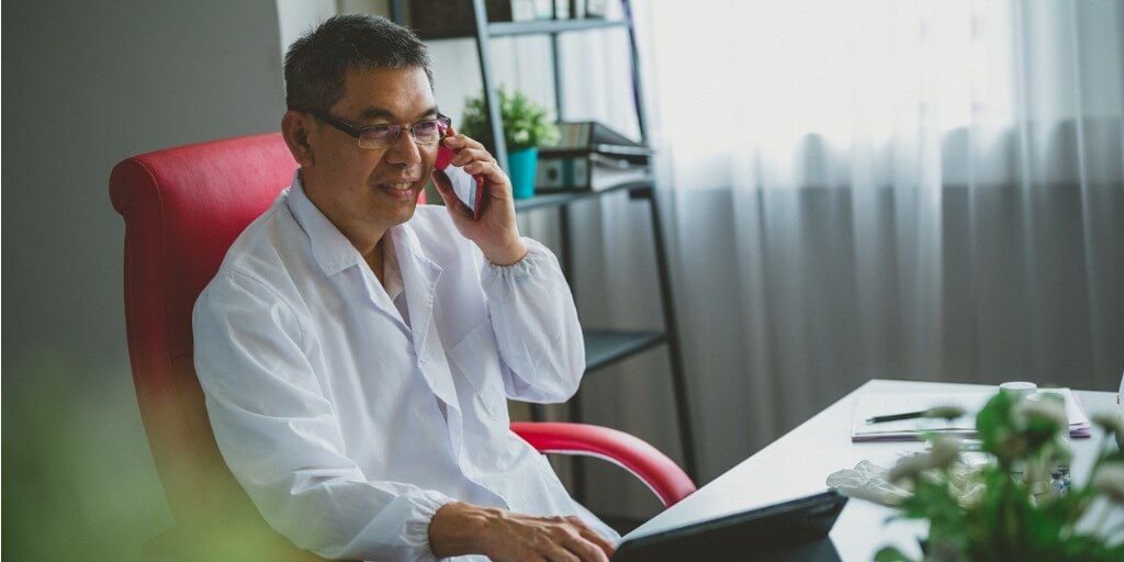 Male doctor on the phone