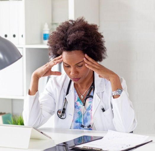Female doctor stressed. 