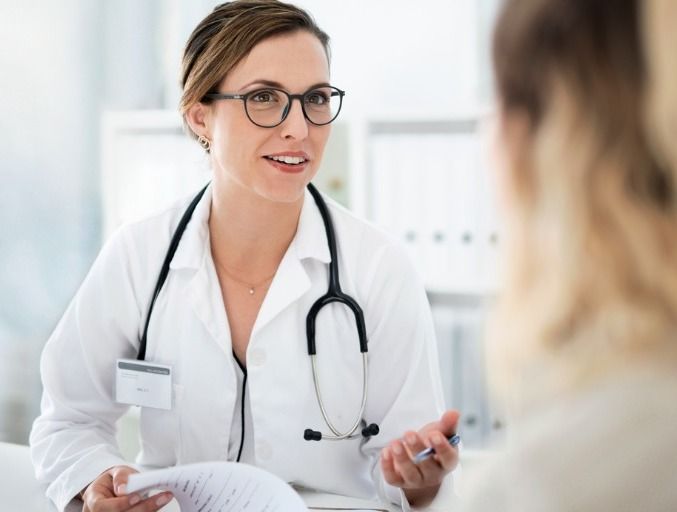 Female concierge doctor chatting with a patient. 