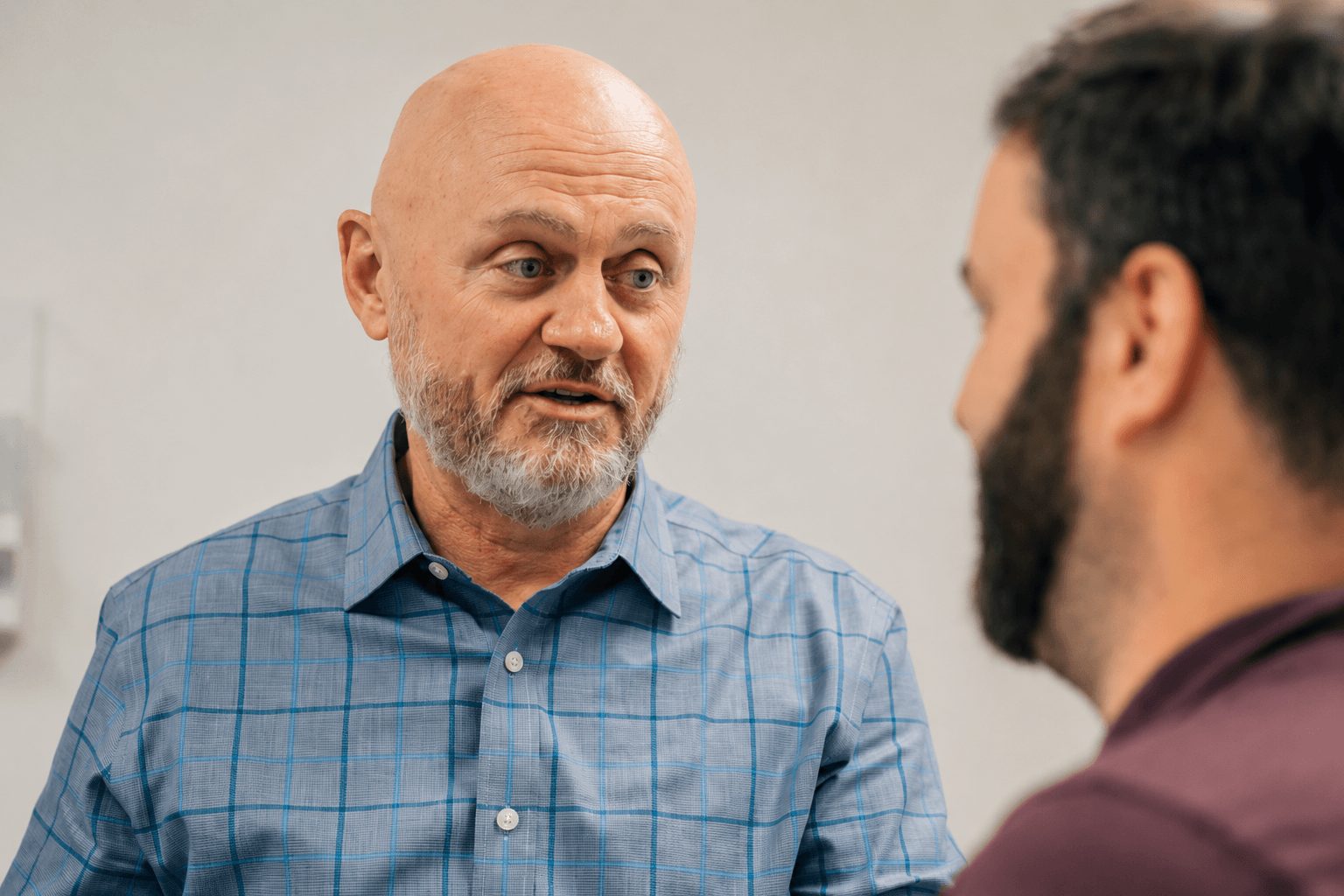 Dr. William Messer discusses a patient's questions during an appointment at PartnerMD Greenville.