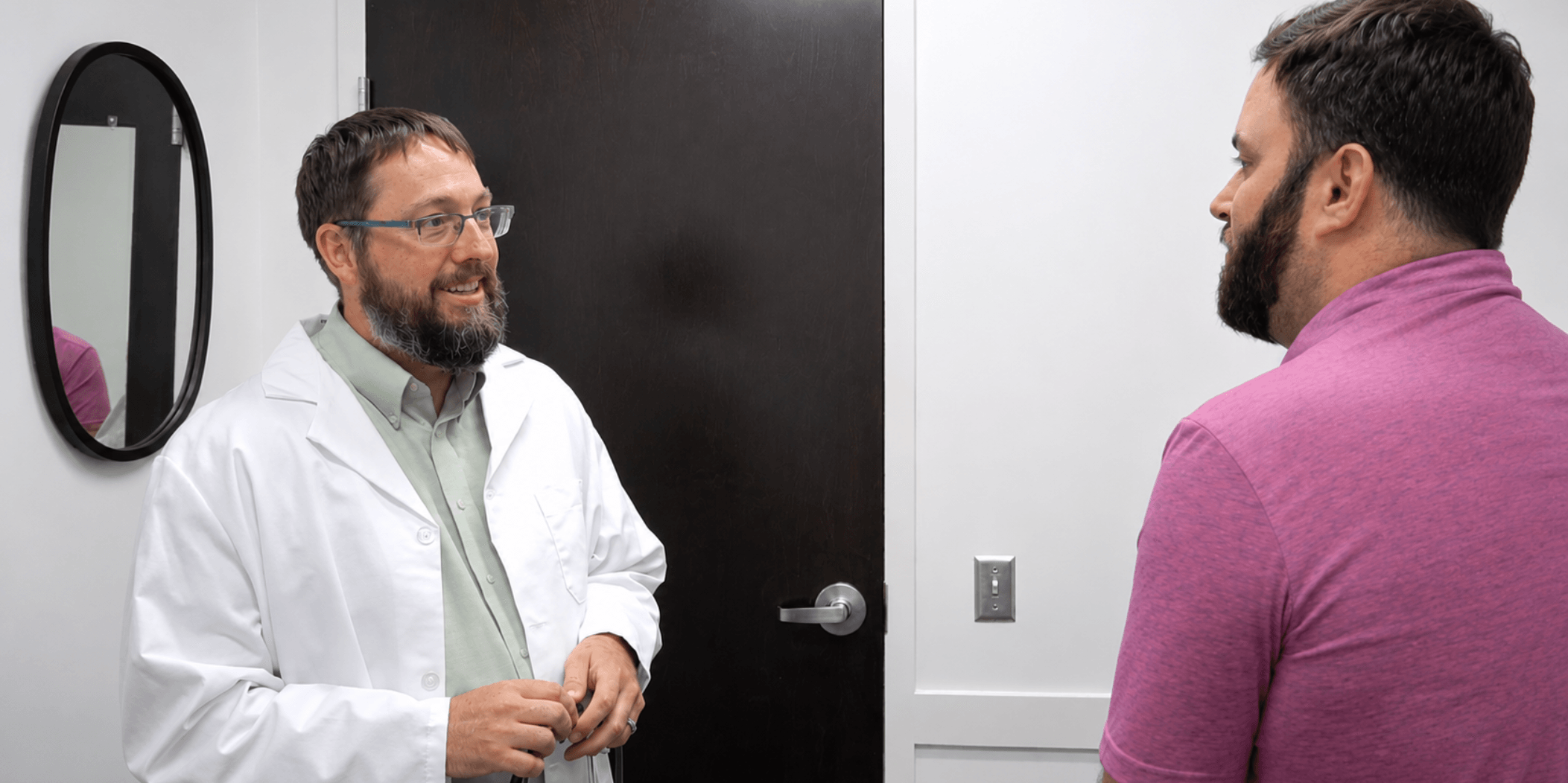 Dr. Matthew Paine speaking with a patient