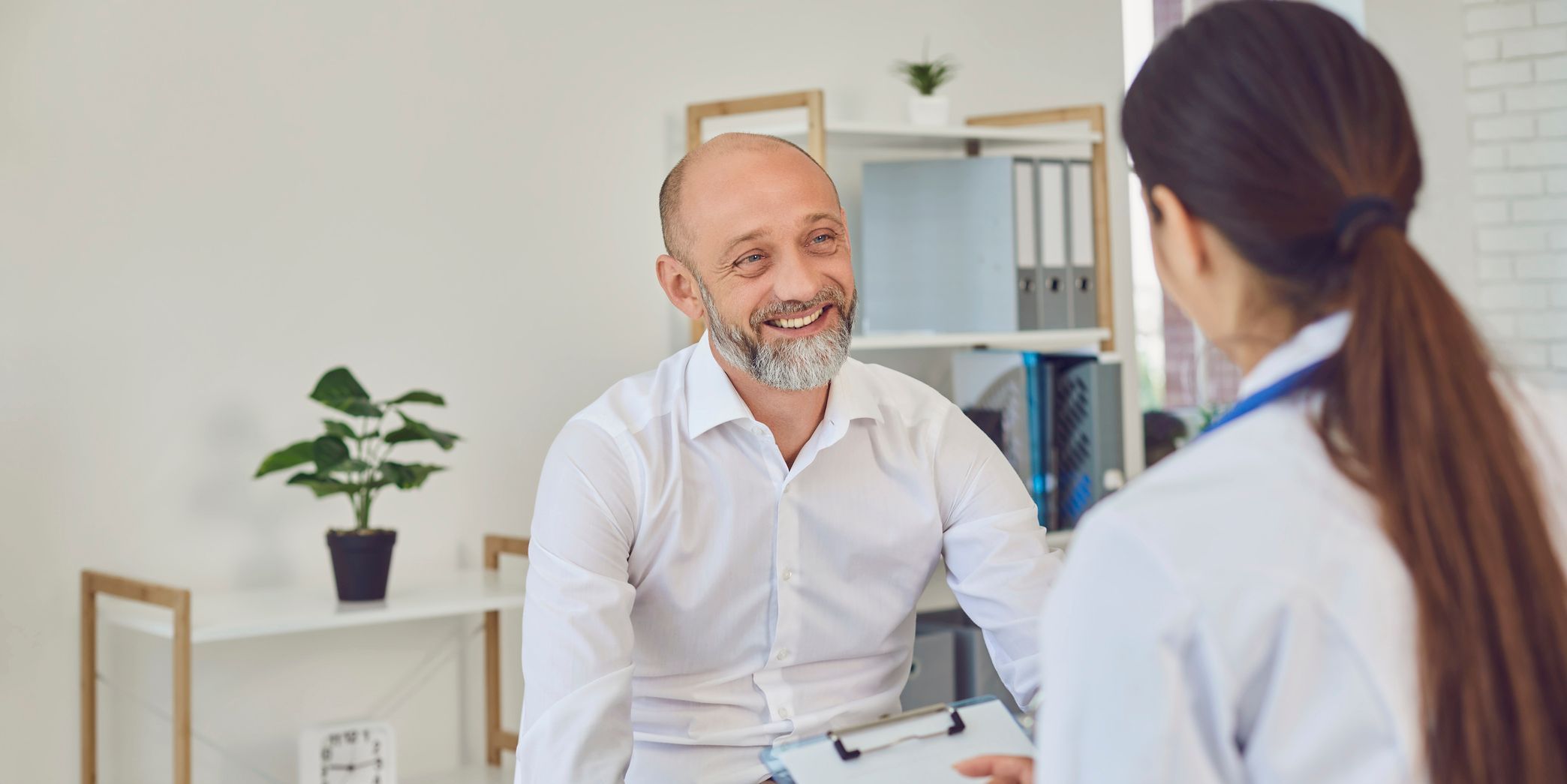 Executive speaking to doctor
