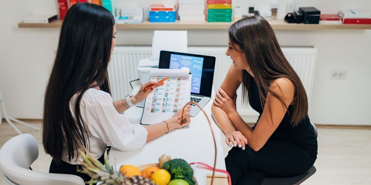 Woman discussing nutrition with health coach