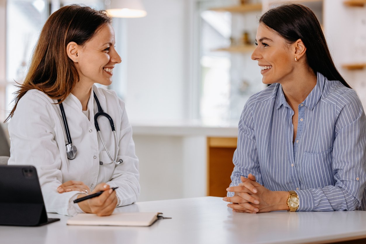 Female doctor speaking to a professional businesswoman