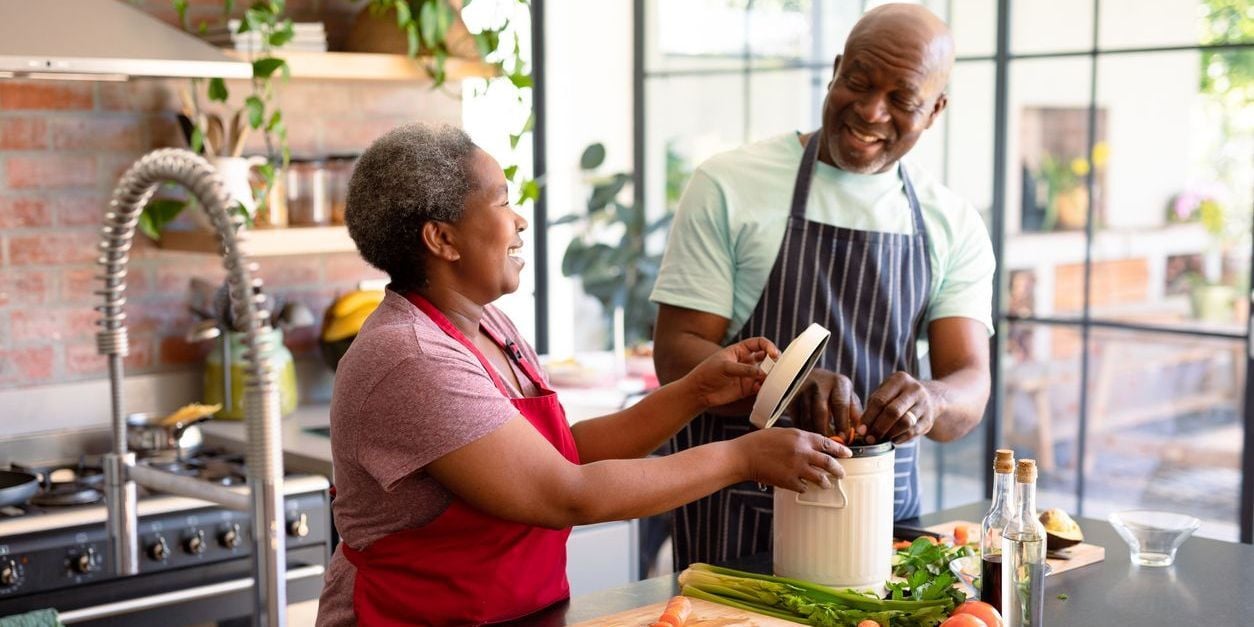 Couple cooking in kitchen