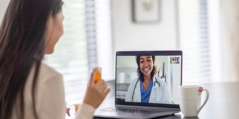 Woman speaking to her doctor online