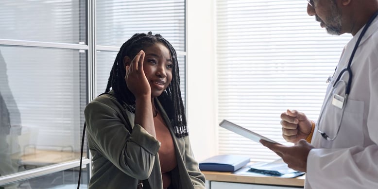 Professional woman visiting primary care doctor