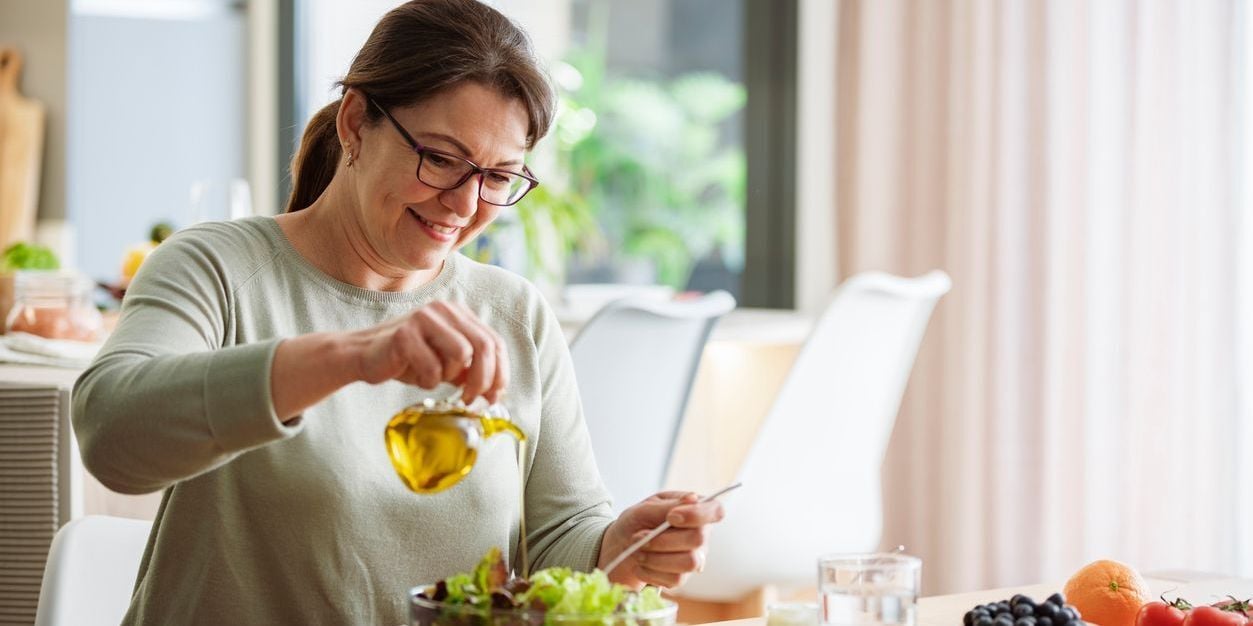 Woman using olive oil