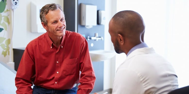 Man talking to his doctor