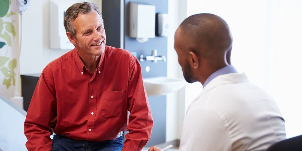 Man talking to doctor