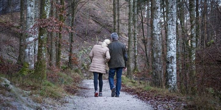 Couple walking in the woods
