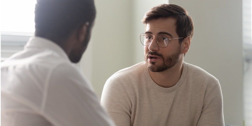 male patient talking about their health with doctor