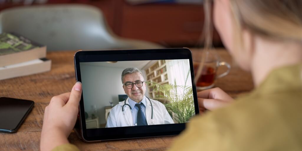 concierge doctor providing care over tablet