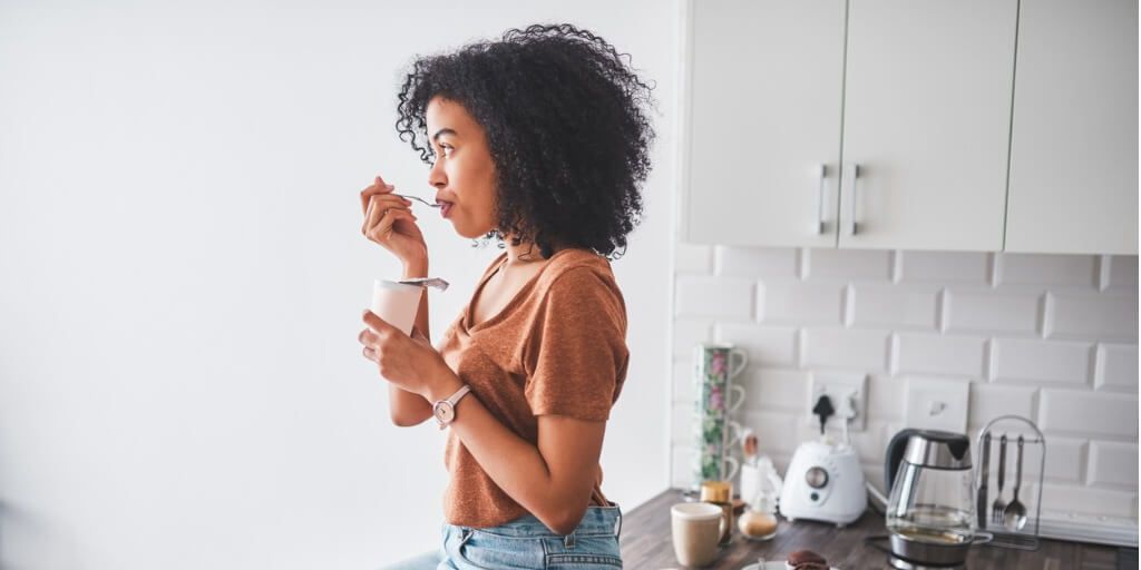 you woman eating probiotics for gut health