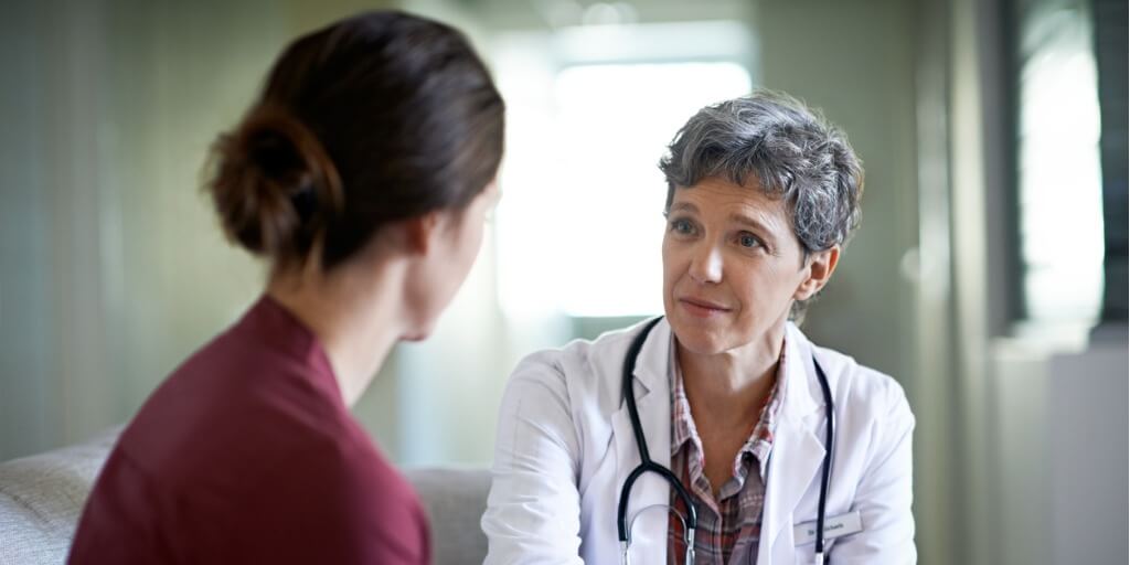 female concierge doctor talking with patient