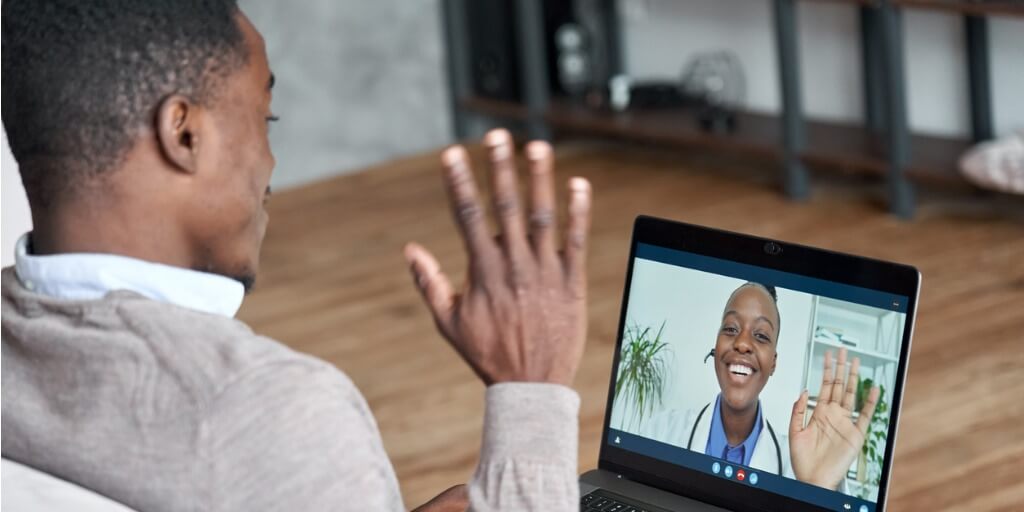 Patient talking to concierge doctor via computer