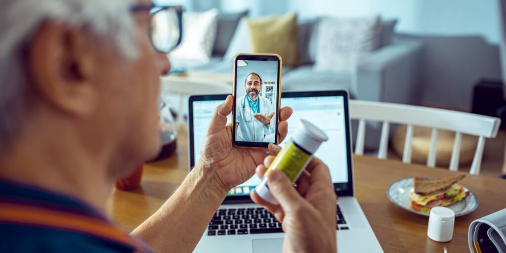 Older patient on a telehealth visit with their physician. 