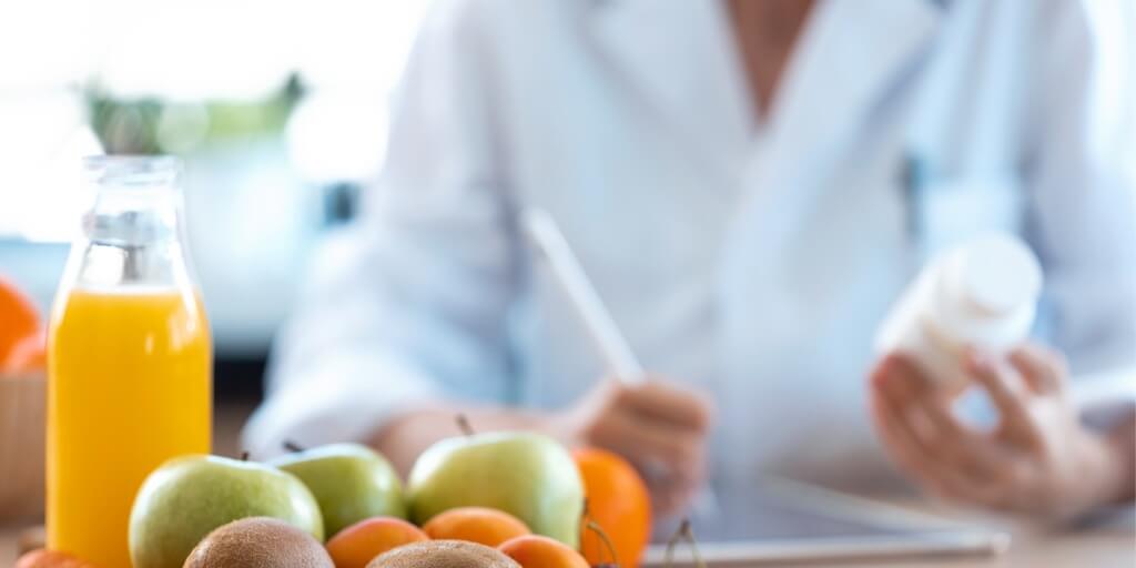 Holistic doctor inspecting a supplement for a patient