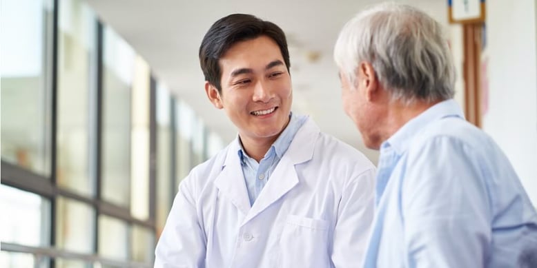 Male concierge doctor with older male patient