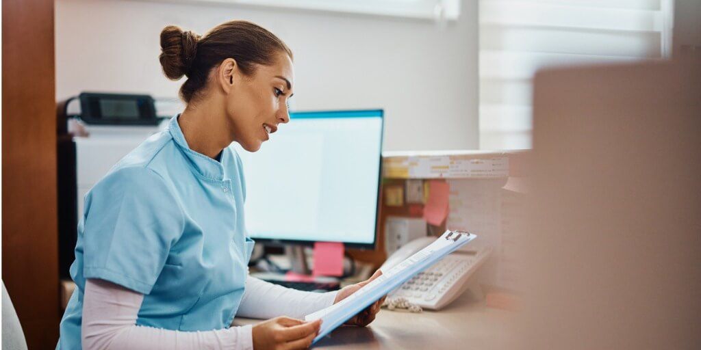 young-nurse-going-through-medical-records-at-reception-desk-in-the-hospital.jpg_s=1024x1024&w=is&k=20&c=I_Qs8a9awoCtdg_vVgy3GBh90Qe2ZJSRE6dZxx_Ur-w= (1)