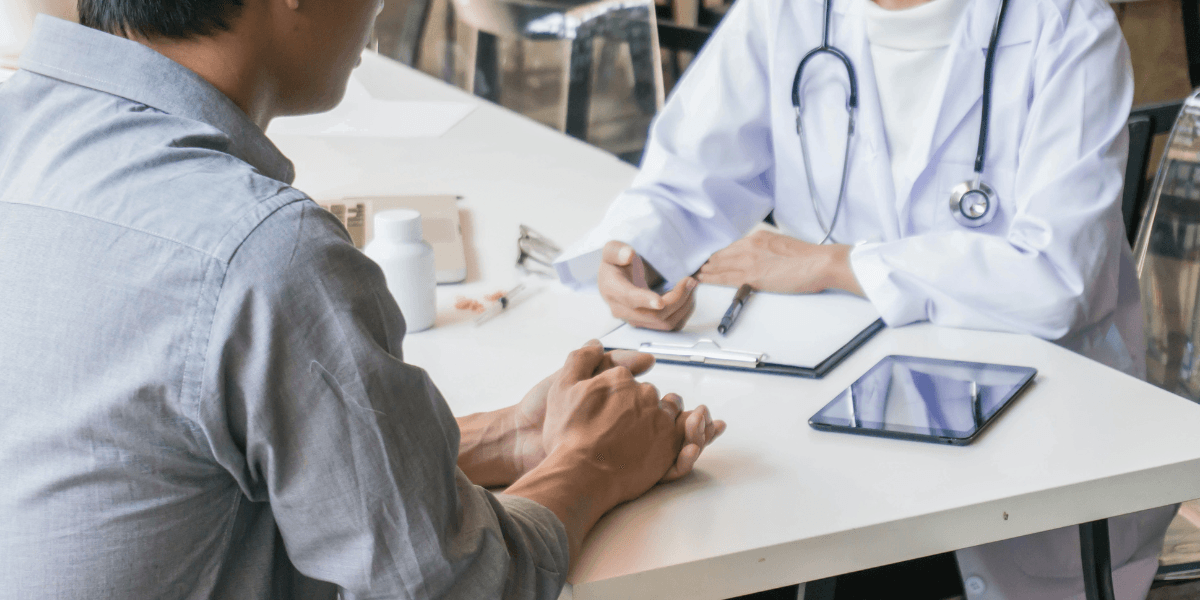 Man talking with doctor