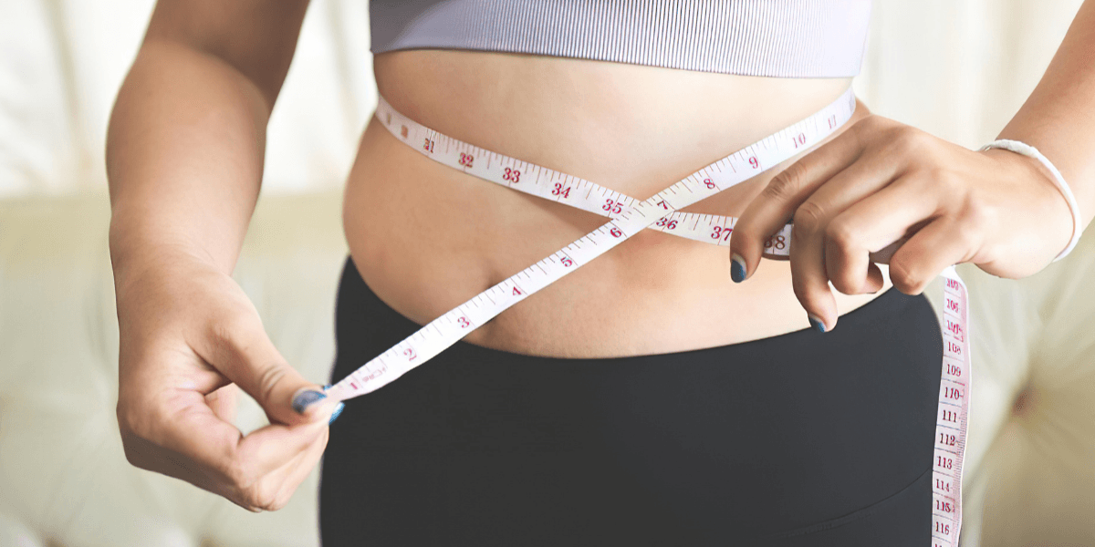 Woman measuring waist