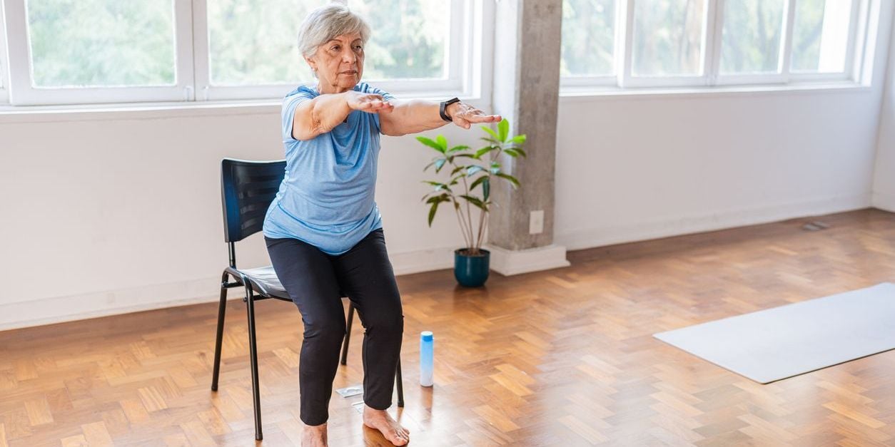 Senior woman doing lower body exercise.