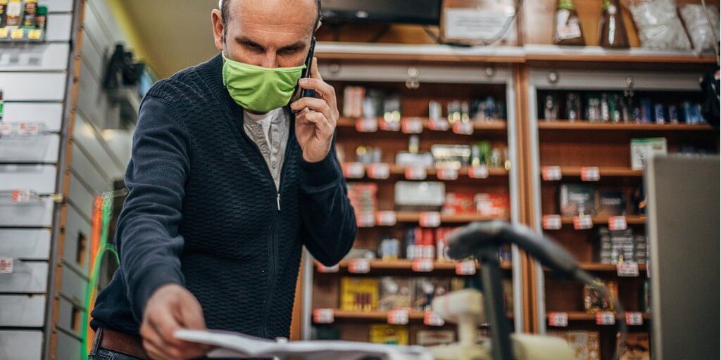 one-man-ordering-new-supplies-for-shop-opening-after-coronavirus-picture-id1222790140