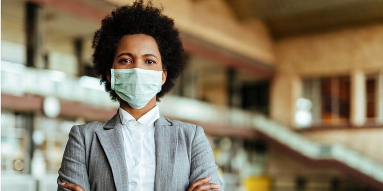 young business executive with mask