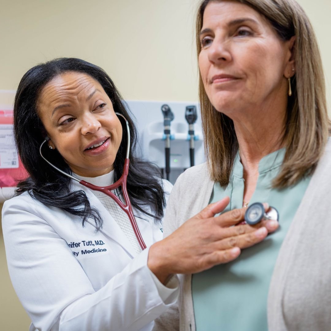 Doctor Tutt listening on a stethoscope