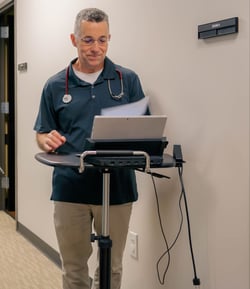 Dr. Norris working on a computer in the Sandy Springs office