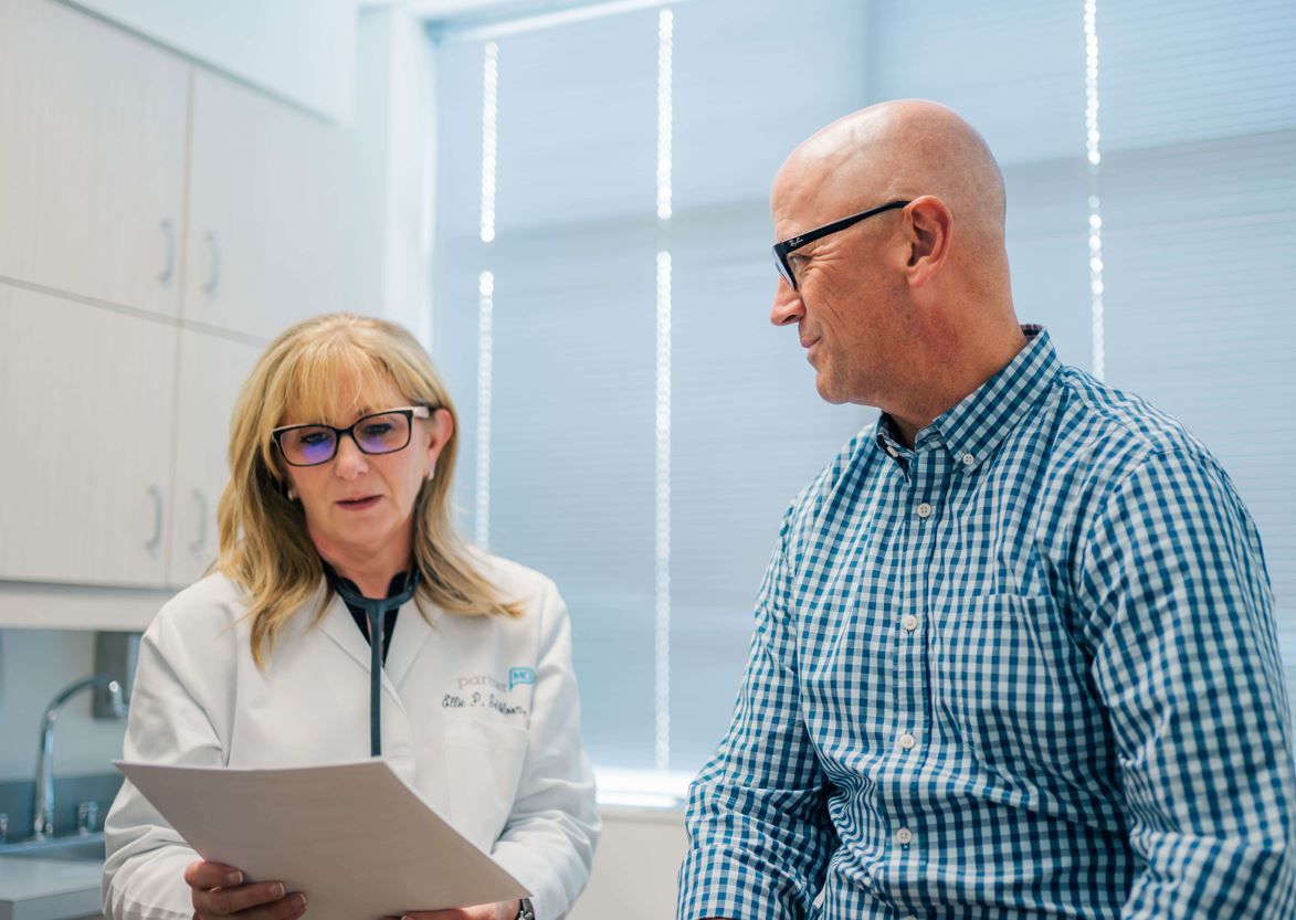 Dr. Ellie Goldboom, a concierge doctor in Owings Mills, reviews information with a patient