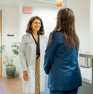 Dr. Mandana Shafai, concierge doctor in Northern Virginia, chatting with a nurse