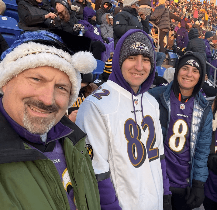 Dr. Carr with his children at a Ravens game