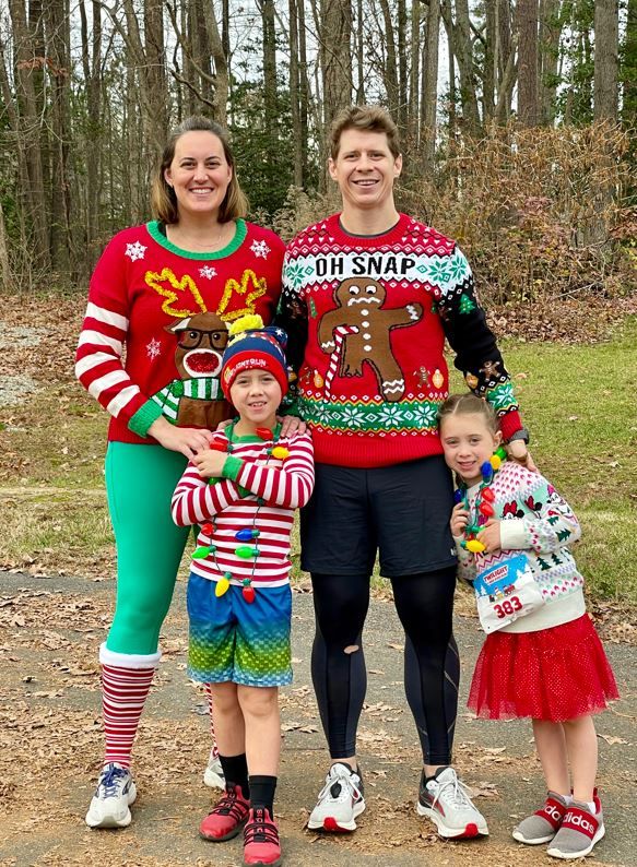 Dr. Dillon and her family in tacky sweaters at a Jingle Bell 5k