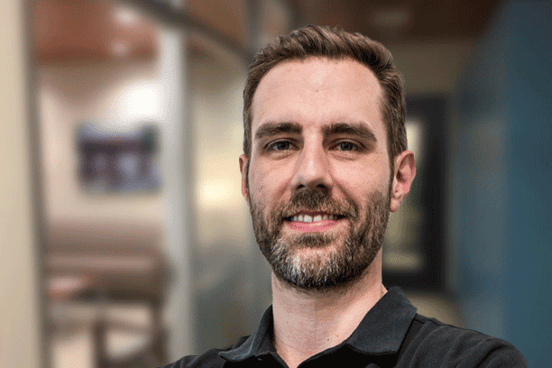 Why is Andrew a health coach? 