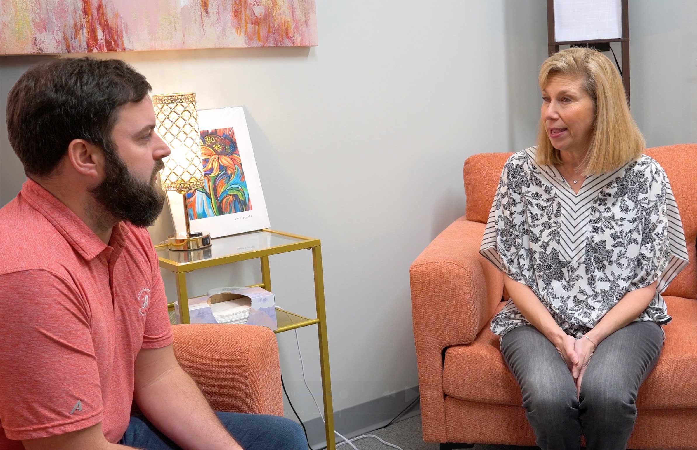 Erin Goldin talking with patient in her office