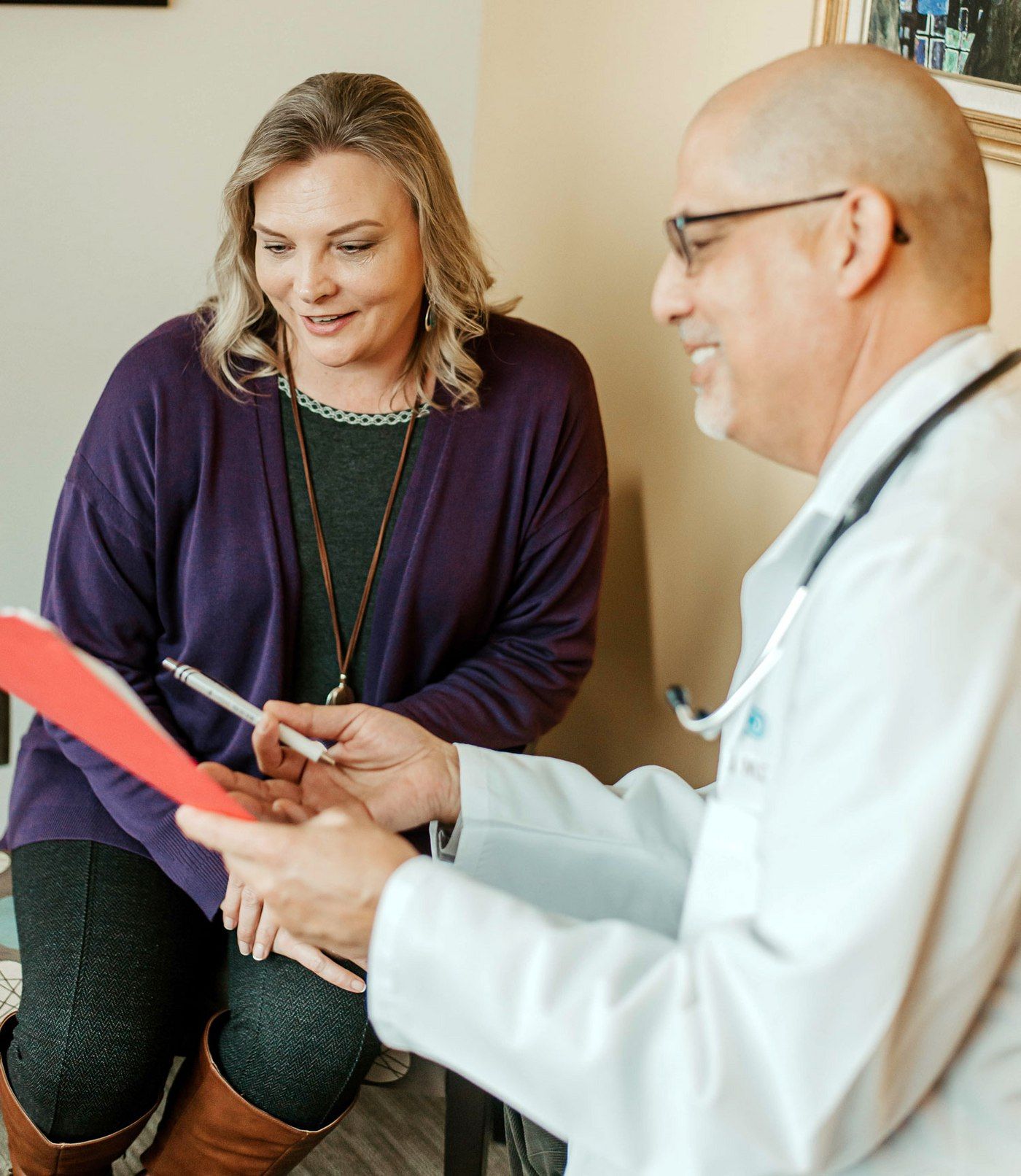 Dr. David Pong reviews health information with a patient