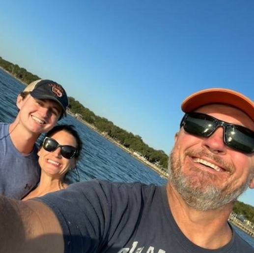 Dr. Messer and his family on a boat