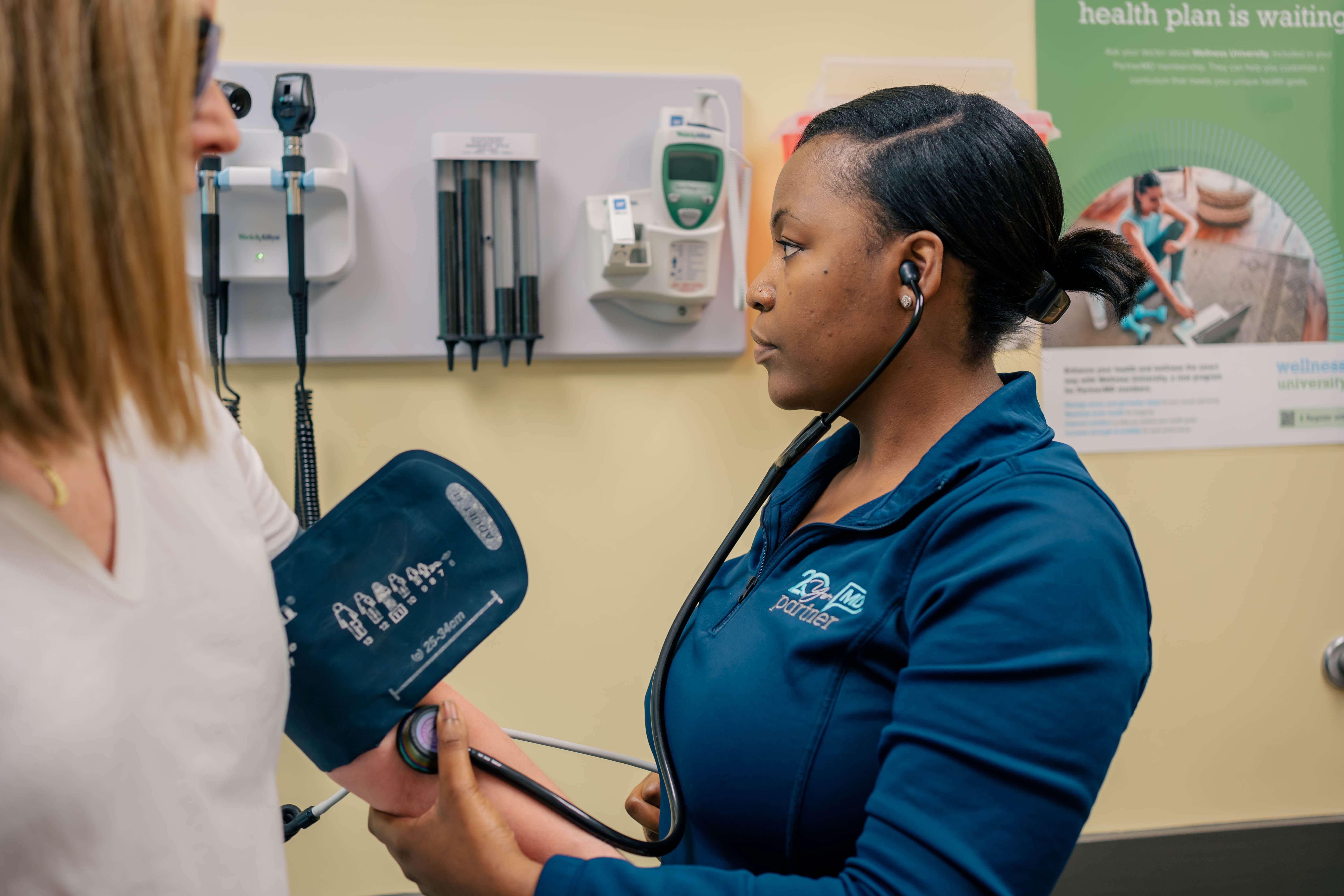 A PartnerMD concierge nurse meets with a patient