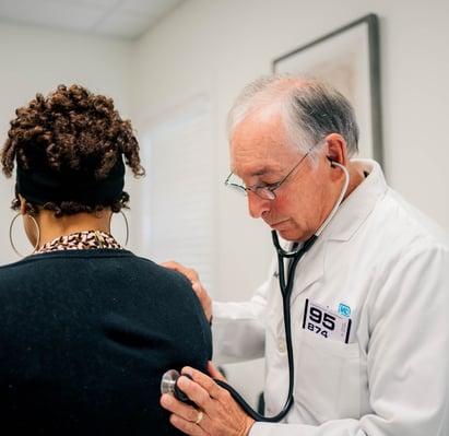 Dr. Jack Durham, Concierge Doctor in Greenville, listens to a patient