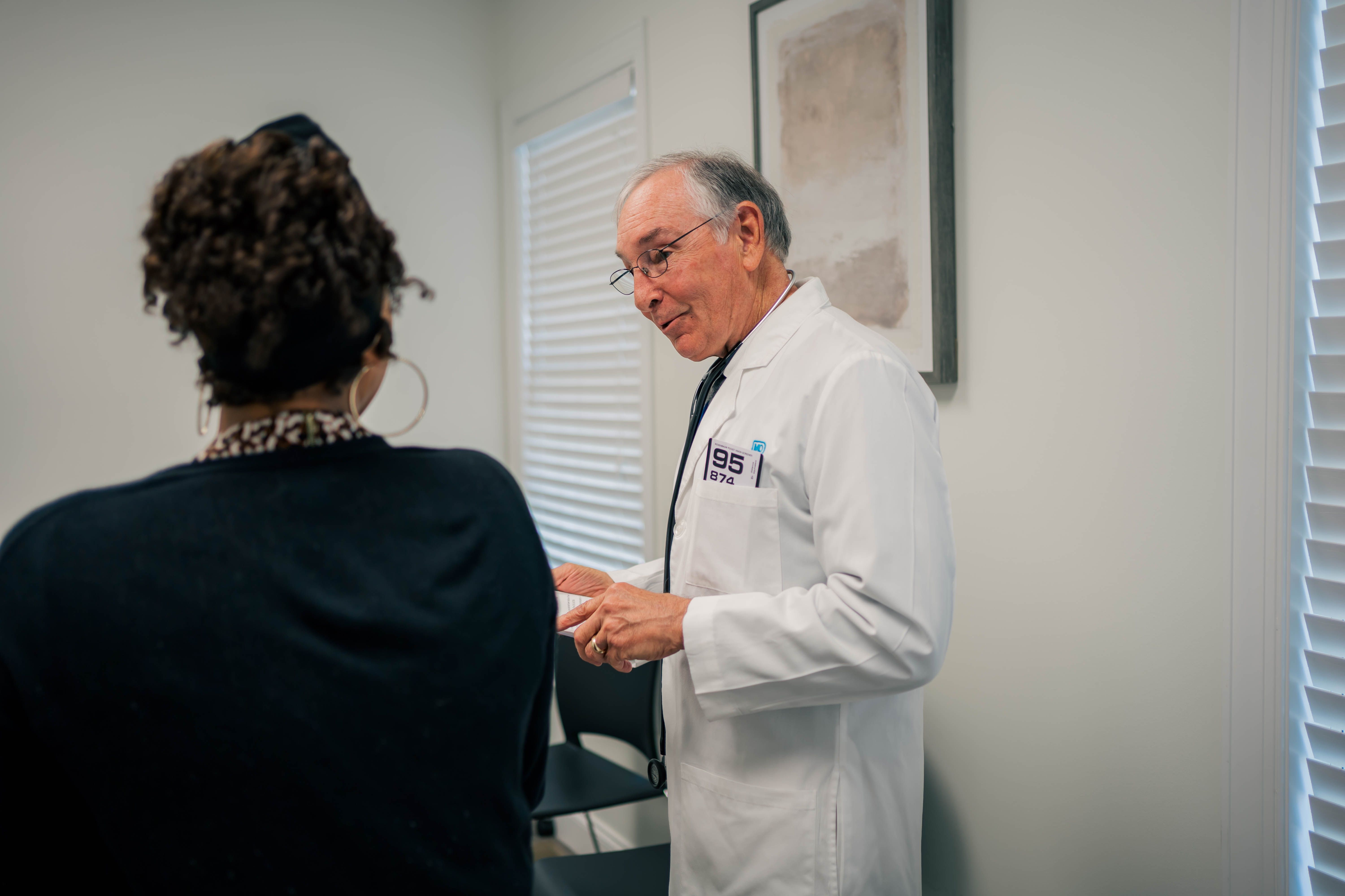 Dr. Durham, a concierge physician, talks with a patient