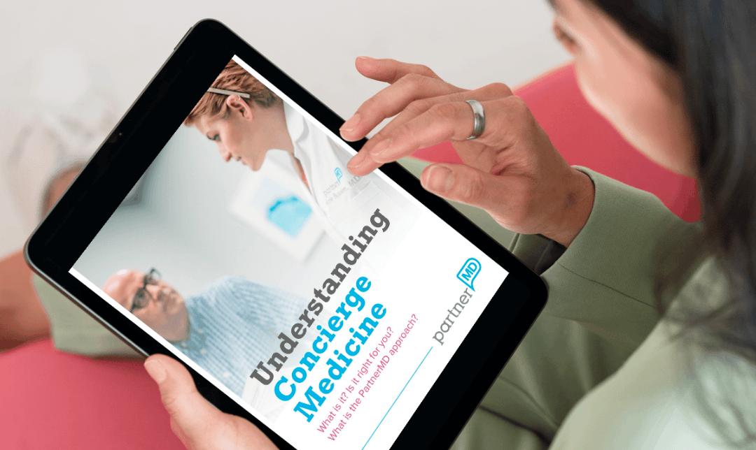image of a female reading the Understanding Concierge Medicine ebook on her tablet