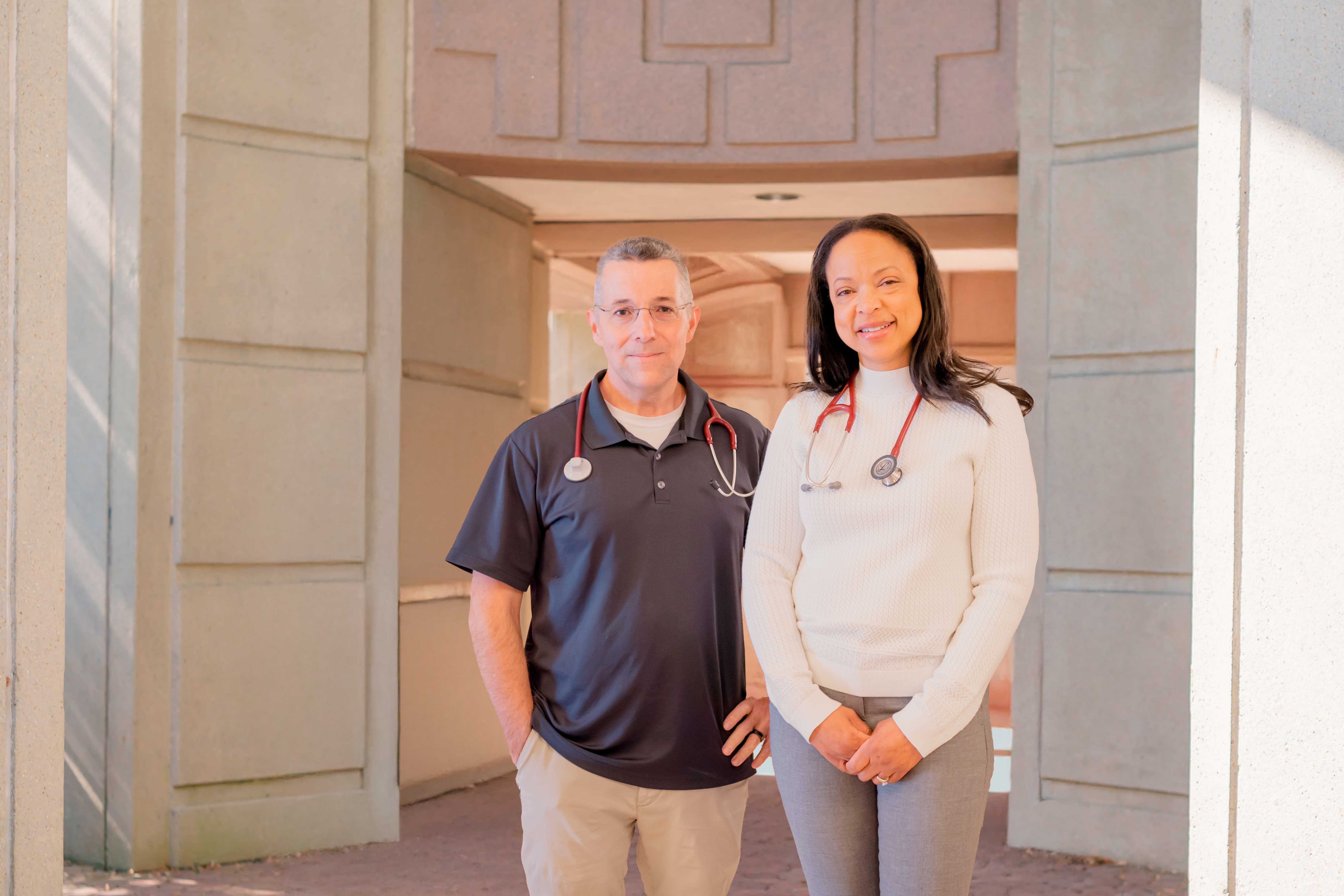 A photo of doctor Norris and doctor Tutt in front of the Sandy Springs office.