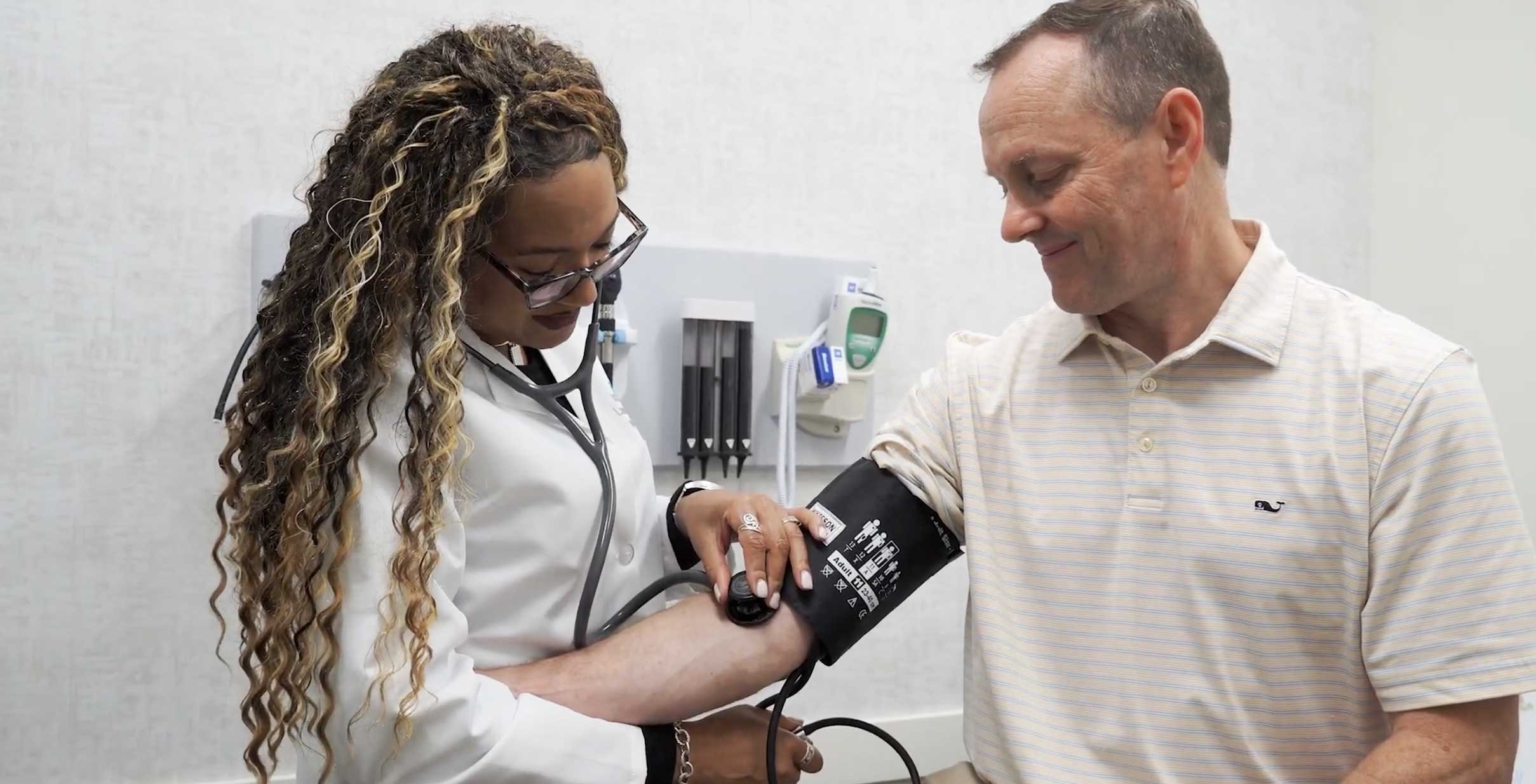 Dr. Fountain-Ellis takes the blood pressure of a patient