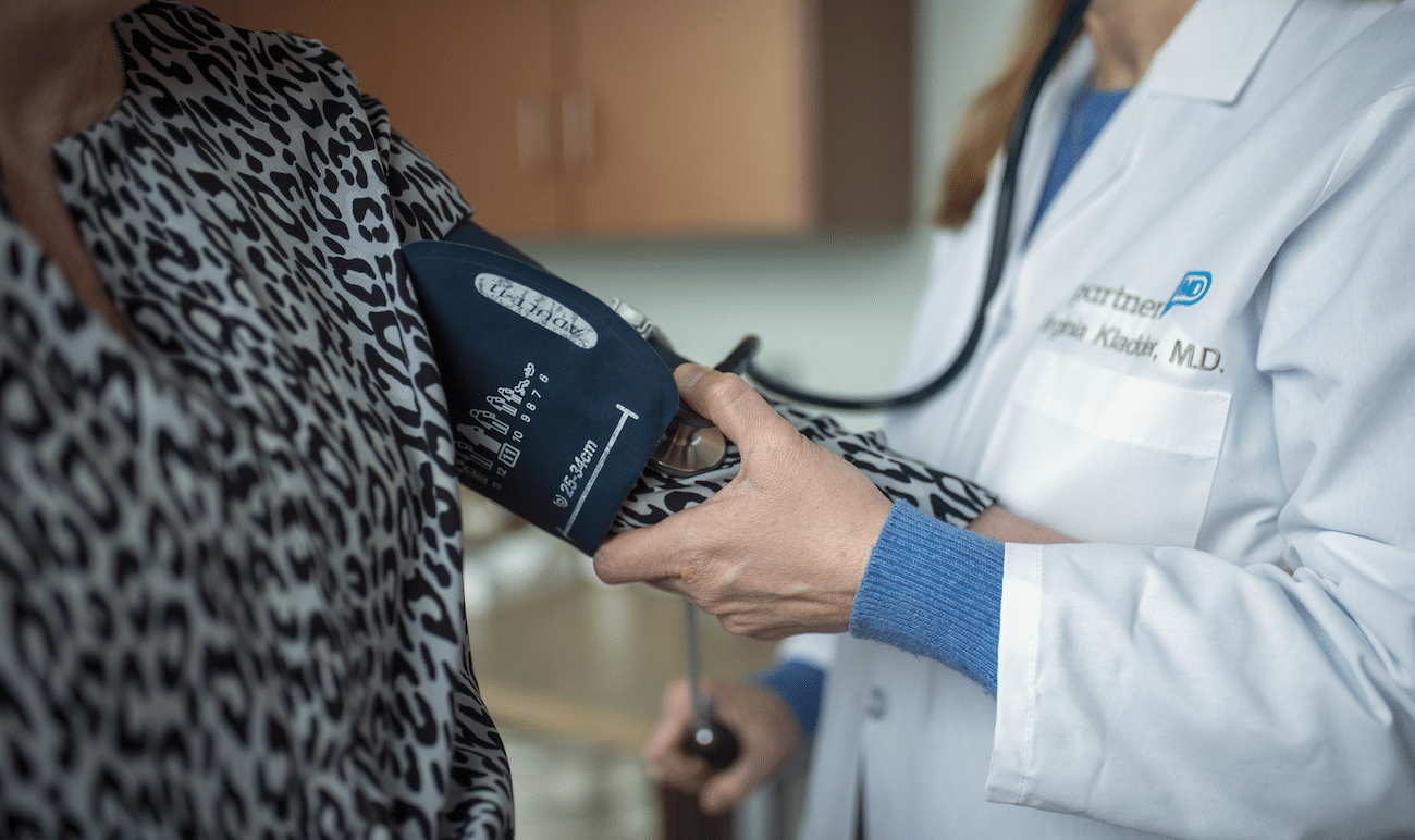 PartnerMD Physician taking blood pressure of patient